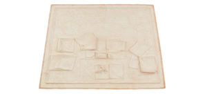 Tactile latex cast of a desk surface and objects by Herbert Stattler, capturing the physical traces, folds, and deformations of a workspace in a flexible, translucent material.